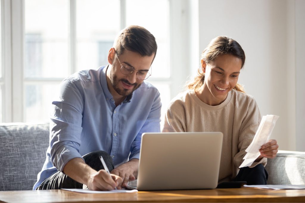 Couple sitting together, financial planning, budgeting, savings, forecast, state pension