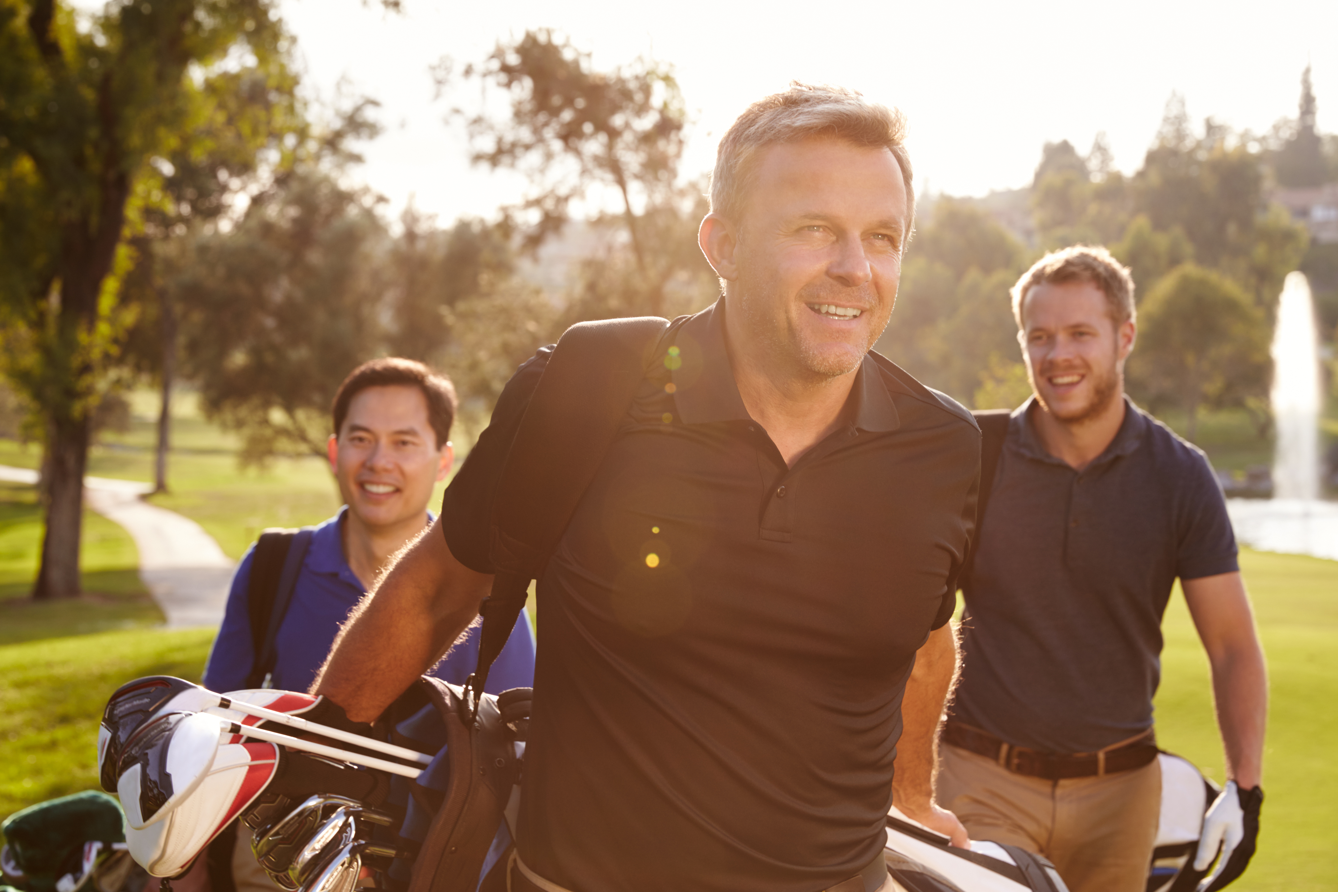 People playing golf, golf course, outdoors, Happy