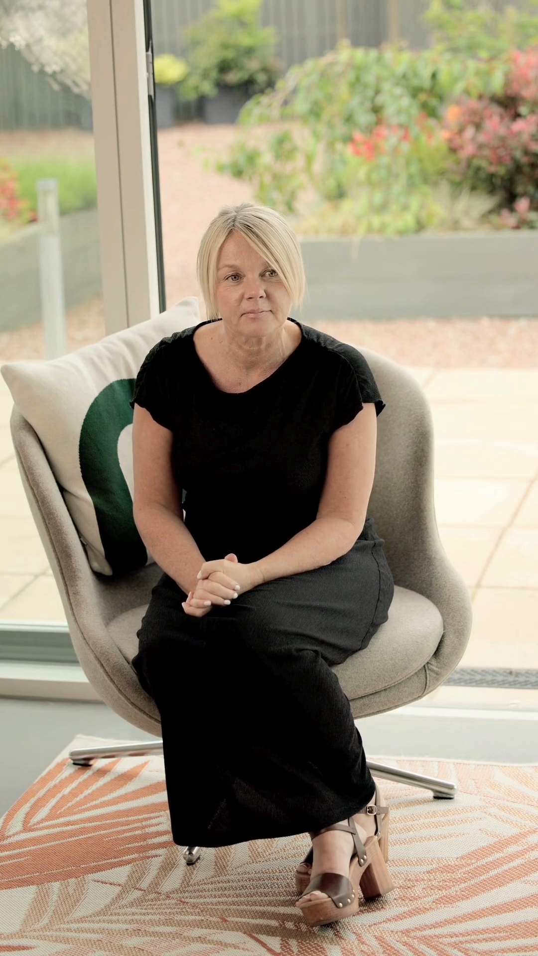 Marie Brownlie, Client Customer Support, sitting in the Glasgow office smiling